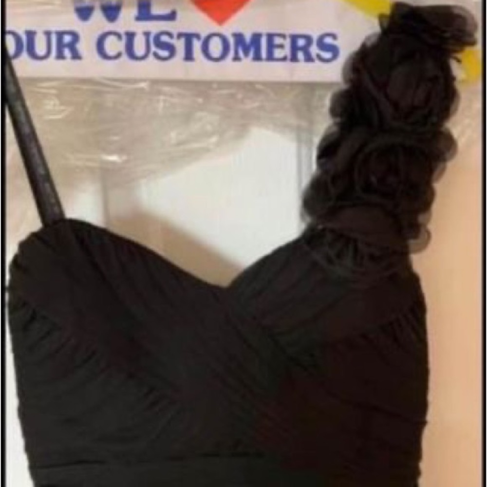 Worn once. Dry cleaned. one strap, tiered-slightly shorter in front then in back